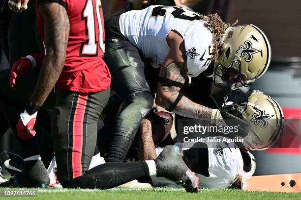 Alontae Taylor celebrates an interception with Tyrann Mathieu of the New Orleans Saints during the second quarter against the Tampa Bay Buccaneers at...