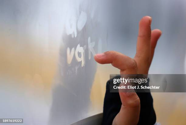 Vegas Golden Knights fan writes on the frosted plexiglass during the 2024 Discover NHL Winter Classic practice at T-Mobile Park on December 31, 2023...