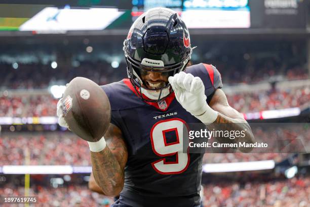 Brevin Jordan of the Houston Texans scores a touchdown during the second quarter of a game against the Tennessee Titans at NRG Stadium on December...
