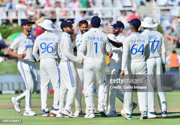 Mukesh Kumar of India celebrates the wicket of Tony de Zorzi of South Africa with team mates during day 1 of the 2nd Test match between South Africa...