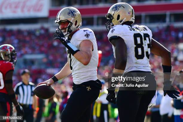 Taysom Hill of the New Orleans Saints reacts to a touchdown during the second quarter against the Tampa Bay Buccaneers at Raymond James Stadium on...