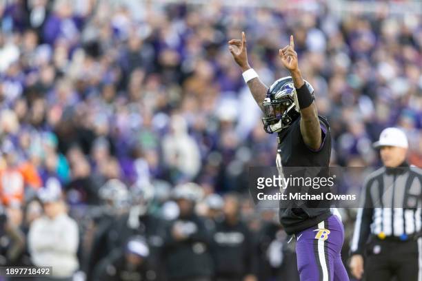 Lamar Jackson of the Baltimore Ravens celebrates after a touchdown during an NFL football game between the Baltimore Ravens and the Miami Dolphins at...
