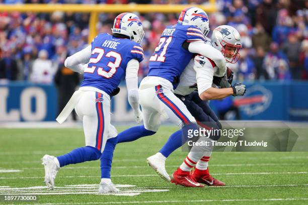 Jordan Poyer of the Buffalo Bills tackles Mike Gesicki of the New England Patriots during the second quarter of a game at Highmark Stadium on...