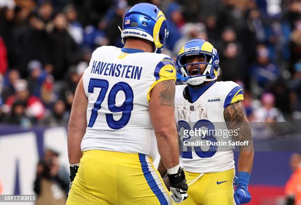 Rob Havenstein of the Los Angeles Rams and Kyren Williams of the Los Angeles Rams react after William's rushing touchdown during the third quarter...