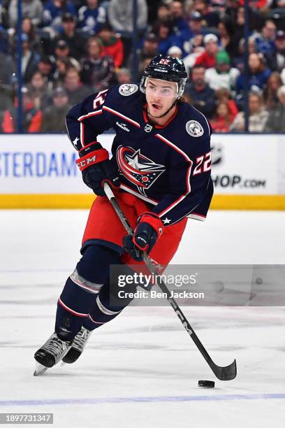 Jake Bean of the Columbus Blue Jackets skates with the puck during the first period of a game against the Toronto Maple Leafs at Nationwide Arena on...