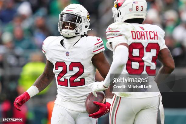 Michael Carter celebrates a touchdown pas with Greg Dortch of the Arizona Cardinals during the third quarter against the Philadelphia Eagles at...