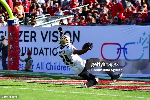 Johnathan Abram of the New Orleans Saints celebrates after an interception during the fourth quarter against the Tampa Bay Buccaneers at Raymond...