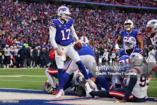 Josh Allen of the Buffalo Bills scores a touchdown during the third quarter of a game against the New England Patriots at Highmark Stadium on...