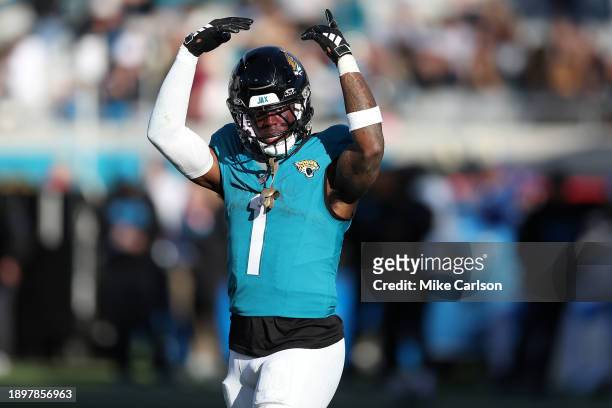 Travis Etienne Jr. #1 of the Jacksonville Jaguars celebrates after a rushing touchdown during the fourth quarter against the Carolina Panthers at...