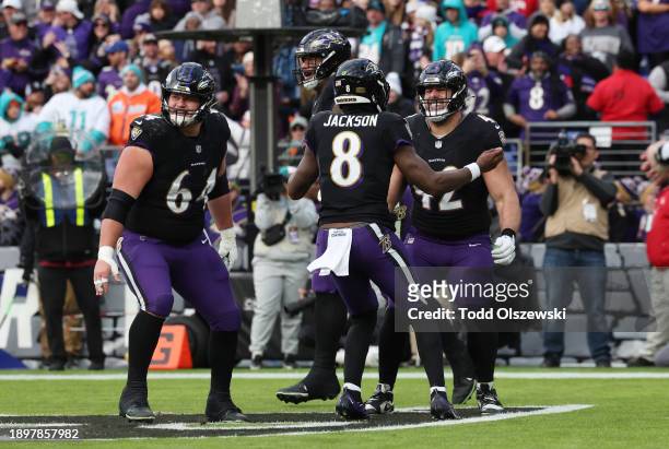 Patrick Ricard of the Baltimore Ravens celebrates with Lamar Jackson after catching a pass for a touchdown against the Miami Dolphins during the...