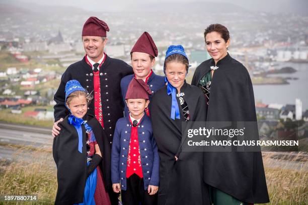 This photo taken on August 23, 2018 shows the Danish Crown Prince couple, Frederik of Denmark and Mary of Denmark , together with their four...