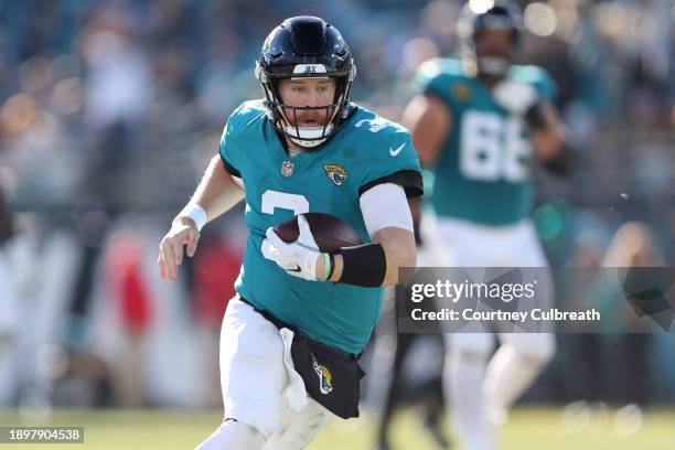 Beathard of the Jacksonville Jaguars runs the ball during the third quarter against the Carolina Panthers at EverBank Stadium on December 31, 2023 in...