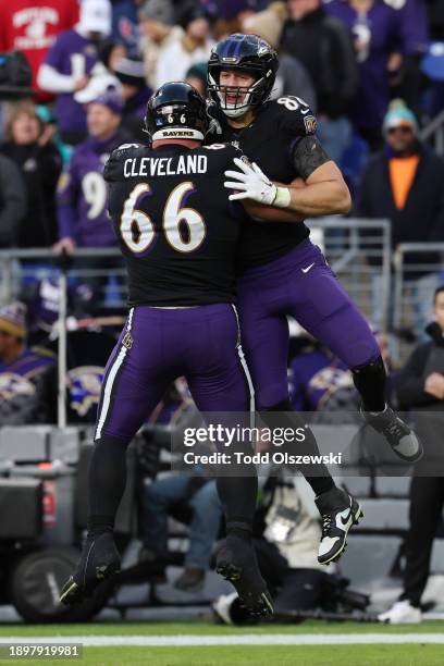 Charlie Kolar and Ben Cleveland of the Baltimore Ravens celebrate a touchdown during the fourth quarter of the game against the Miami Dolphins at M&T...