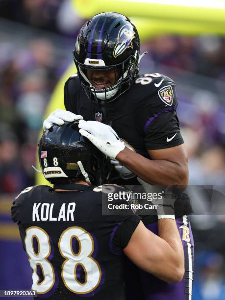 Charlie Kolar and Ben Cleveland of the Baltimore Ravens celebrate a touchdown during the fourth quarter of the game against the Miami Dolphins at M&T...