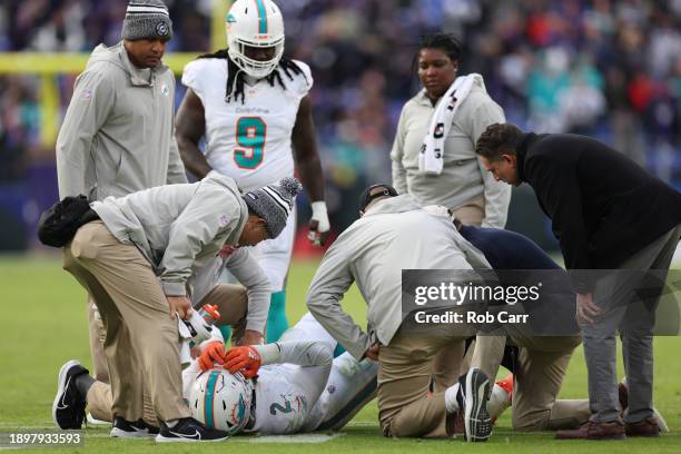 Bradley Chubb of the Miami Dolphins lies on the field with an apparent injury during the fourth quarter of the game against the Baltimore Ravens at...