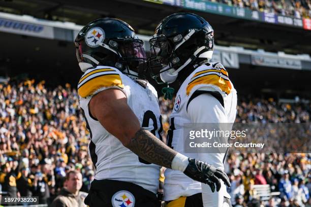 Jaylen Warren of the Pittsburgh Steelers reacts after a first quarter touchdown against the Seattle Seahawks at Lumen Field on December 31, 2023 in...
