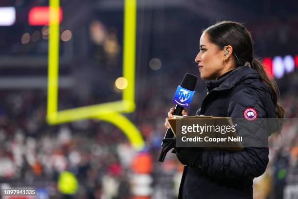 Kaylee Hartung looks on from the sidelines at halftime during an NFL football game between the New York Jets and the Cleveland Browns at Cleveland...