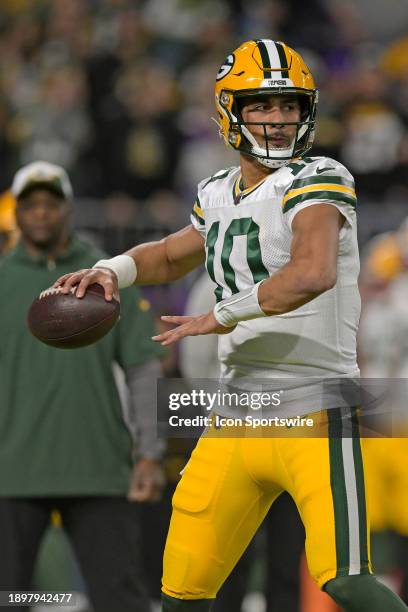 Green Bay Packers quarterback Jordan Love warms up before an NFL game between the Minnesota Vikings and Green Bay Packers on December 31 at U.S. Bank...