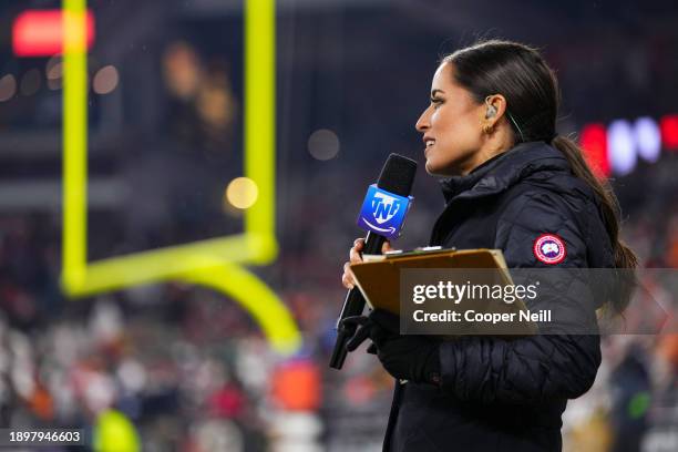 Kaylee Hartung looks on from the sidelines at halftime during an NFL football game between the New York Jets and the Cleveland Browns at Cleveland...