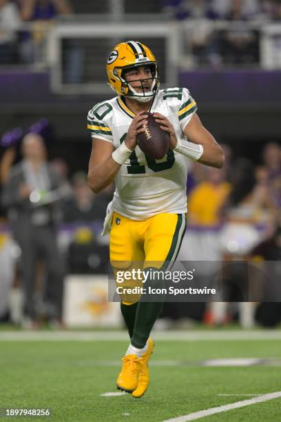 Green Bay Packers quarterback Jordan Love scrambles out of the pocket during an NFL game between the Minnesota Vikings and Green Bay Packers on...