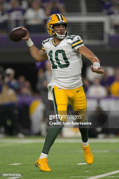 Green Bay Packers quarterback Jordan Love throws on the run during an NFL game between the Minnesota Vikings and Green Bay Packers on December 31 at...