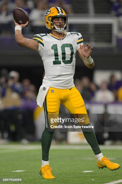 Green Bay Packers quarterback Jordan Love throws on the run during an NFL game between the Minnesota Vikings and Green Bay Packers on December 31 at...