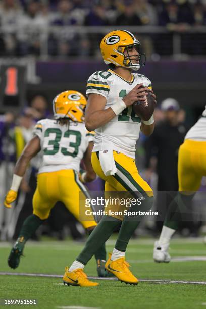 Green Bay Packers quarterback Jordan Love looks to throw during an NFL game between the Minnesota Vikings and Green Bay Packers on December 31 at...