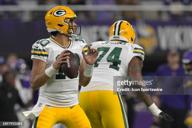 Green Bay Packers quarterback Jordan Love looks to throw during an NFL game between the Minnesota Vikings and Green Bay Packers on December 31 at...