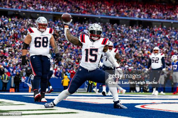 Ezekiel Elliott of the New England Patriots spikes the ball after scoring a touchdown during the game against the Buffalo Bills at Highmark Stadium...