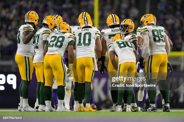 Green Bay Packers quarterback Jordan Love calls a play in a huddle during an NFL game between the Minnesota Vikings and Green Bay Packers on December...