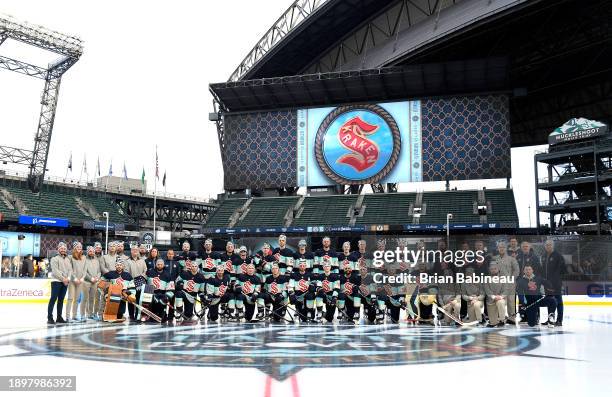 The Seattle Kraken pose for a team photo at center ice before the 2024 Discover NHL Winter Classic practice at T-Mobile Park on December 31, 2023 in...