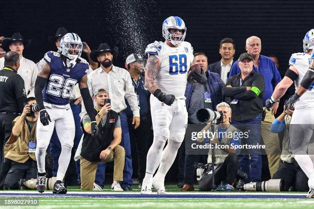 Detroit Lions offensive tackle Taylor Decker catches a pass for a two point attempt in the end zone and celebrates during the game between the Dallas...