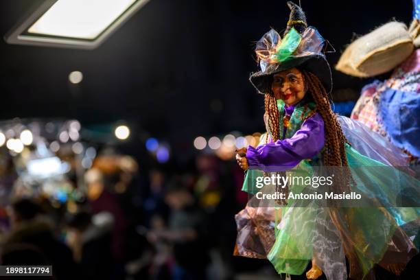 General view shows a cloth doll representing the Befana, the old woman from Italian folklore who delivers treats and small gifts to children on the...