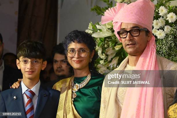 Bollywood actor Amir Khan , his former wife and Indian film producer, screenwriter and director Kiran Rao and their son Azad Rao Khan pose for...