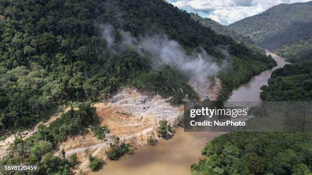 Construction workers are building the biggest hydropower plant in Southeast Asia along the Kayan River at Long Peso, Bulungan, in North Kalimantan,...