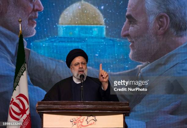 Iranian President Ebrahim Raisi is speaking during a ceremony commemorating the anniversary of the killing of the former commander of the Islamic...