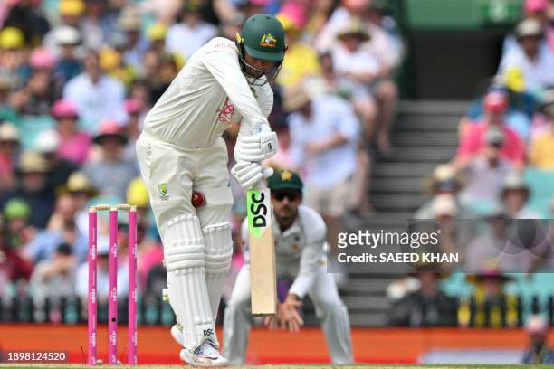 Australia's Usman Khawaja fails to play a shot during the second day of the third cricket Test match between Australia and Pakistan at the Sydney...