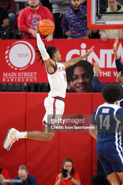 St John's Red Storm guard Daniss Jenkins drives in for a dunk during the men's college basketball game between the Butler Bulldogs and St. John's Red...