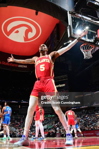 Dejounte Murray of the Atlanta Hawks plays defense during the game against the Oklahoma City Thunder on January 3, 2024 at State Farm Arena in...