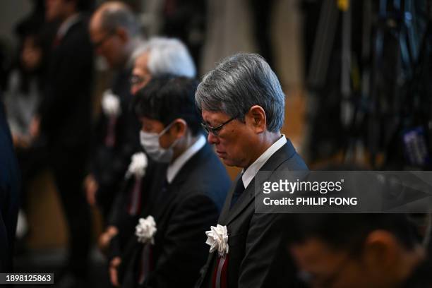 Guests make a silent prayer for the victims of the earthquake in Ishikawa prefecture and the Haneda airport accident during the ceremony on the first...