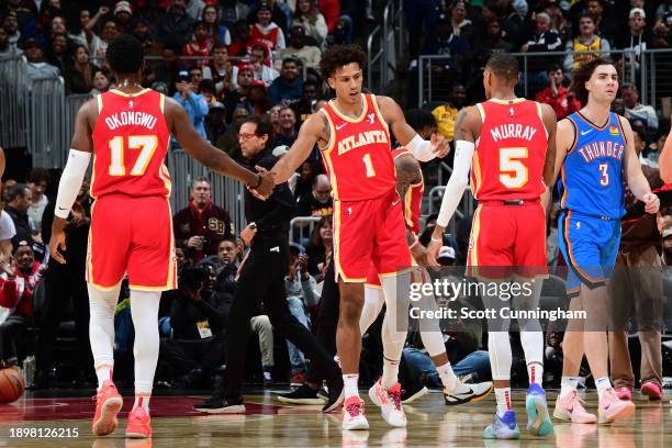 Jalen Johnson of the Atlanta Hawks is congratulated during the game against the Oklahoma City Thunder on January 3, 2024 at State Farm Arena in...