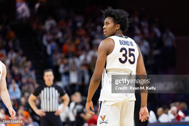 Leon Bond III of the Virginia Cavaliers reacts to his torn jersey in the second half during a game against the Louisville Cardinals at John Paul...