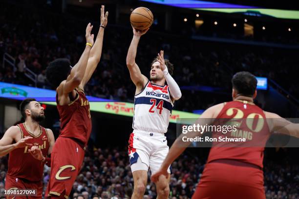 Corey Kispert of the Washington Wizards shoots against Jarrett Allen of the Cleveland Cavaliers during the second half at Rocket Mortgage Fieldhouse...