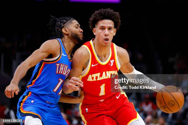 Jalen Johnson of the Atlanta Hawks drives against Isaiah Joe of the Oklahoma City Thunder during the second half at State Farm Arena on January 3,...