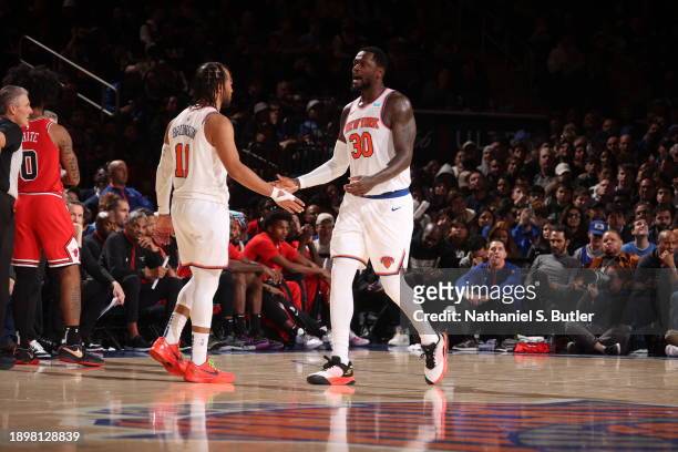 Julius Randle high fives Jalen Brunson of the New York Knicks during the game against the Chicago Bulls on January 3, 2024 at Madison Square Garden...