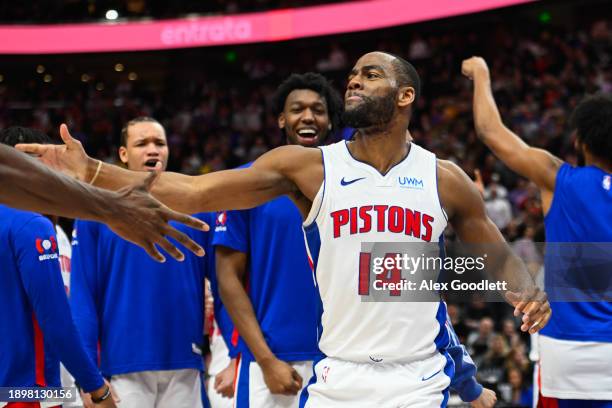 Alec Burks of the Detroit Pistons celebrates a shot at the buzzer during the second half of a game against the Utah Jazz at Delta Center on January...