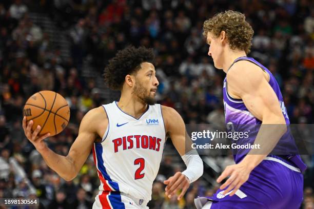 Cade Cunningham of the Detroit Pistons looks for a pass against Lauri Markkanen of the Utah Jazz during the second half of a game at Delta Center on...