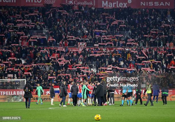 Girona players and supporters are celebrating at the end of the match between Girona FC and Club Atletico de Madrid for week 19 of the LaLiga EA...