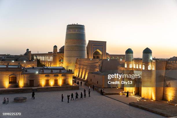 Night view of main gate of Khan's palace Kohna Ark, Khiva, Uzbekistan. Translation of writings: Palace of Old Fortress, 17-19 century in Uzbek