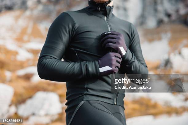 a confident cyclist in professional gear - triathlon gear stock pictures, royalty-free photos & images